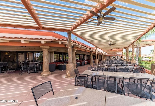 view of patio / terrace featuring outdoor dining space and a ceiling fan