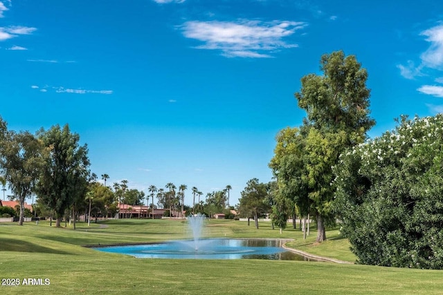 surrounding community featuring a yard and a water view