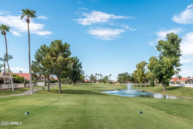 surrounding community featuring view of golf course, a water view, and a yard