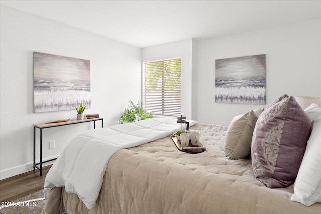 bedroom with hardwood / wood-style floors