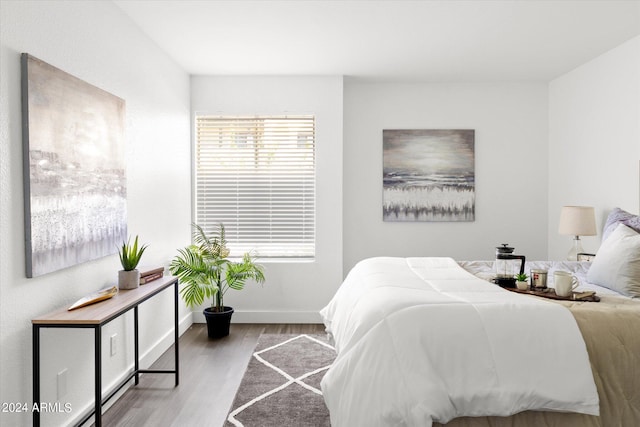 bedroom with light wood-type flooring