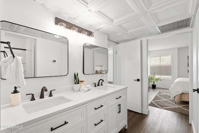 bathroom featuring hardwood / wood-style flooring, beamed ceiling, vanity, and coffered ceiling