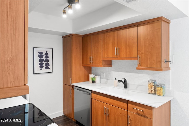 kitchen featuring range, dark hardwood / wood-style floors, sink, decorative backsplash, and stainless steel dishwasher