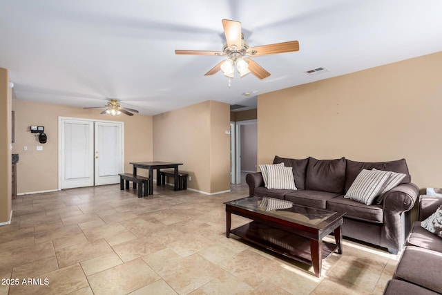 living room featuring ceiling fan