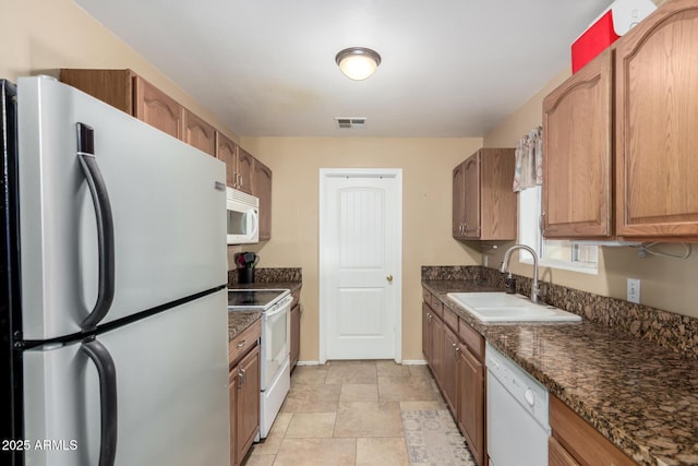 kitchen with sink and white appliances