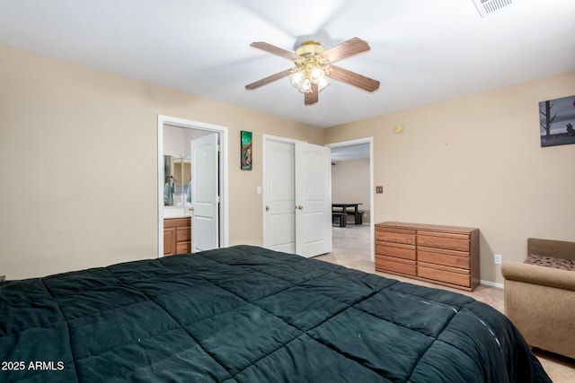 bedroom with ensuite bathroom and ceiling fan