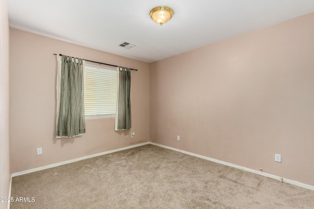 unfurnished room with light colored carpet