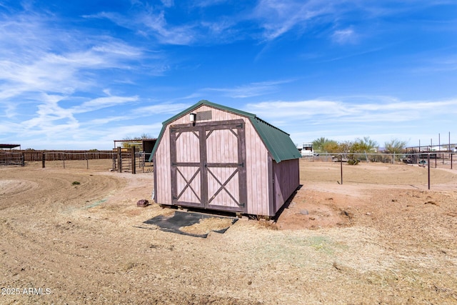 view of outdoor structure featuring a rural view