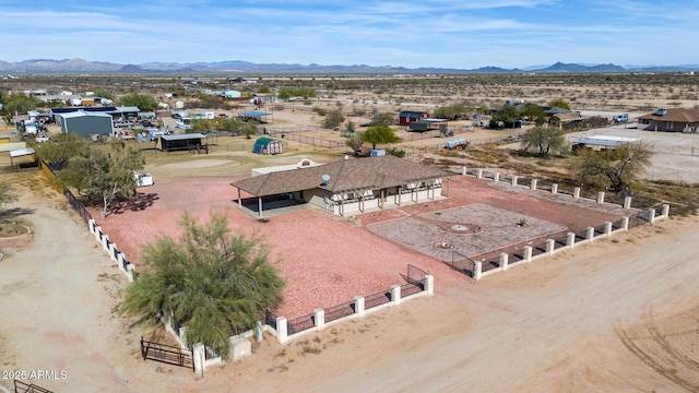 birds eye view of property featuring a mountain view