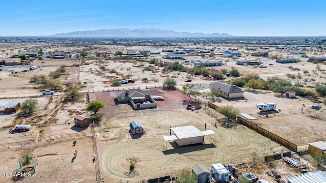 birds eye view of property with a mountain view