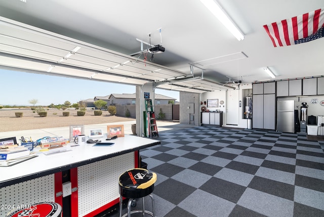 garage featuring gas water heater and a garage door opener