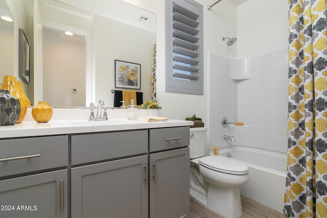 full bathroom featuring hardwood / wood-style flooring, toilet, shower / tub combo, and vanity