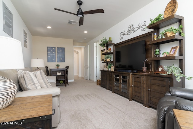 living room with light carpet and ceiling fan