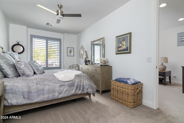 carpeted bedroom with multiple windows and ceiling fan