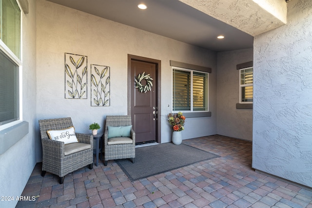 property entrance with a patio