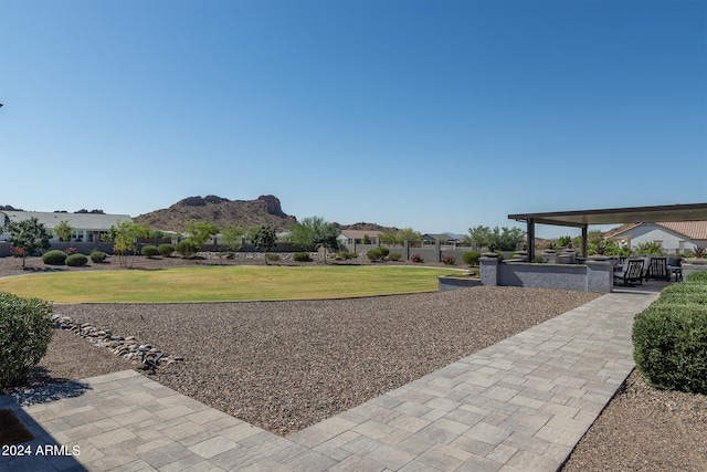 exterior space featuring a mountain view and a patio