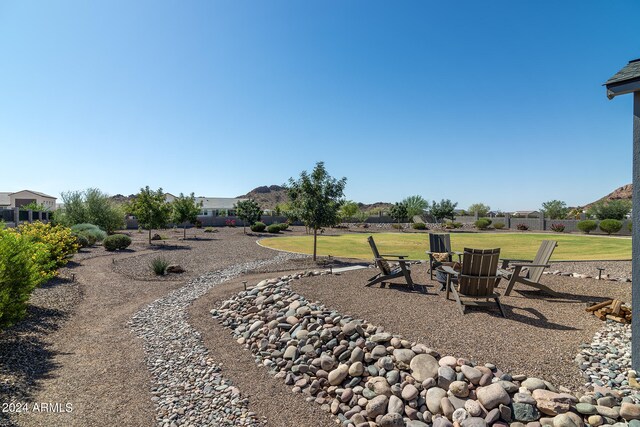 view of yard with an outdoor fire pit