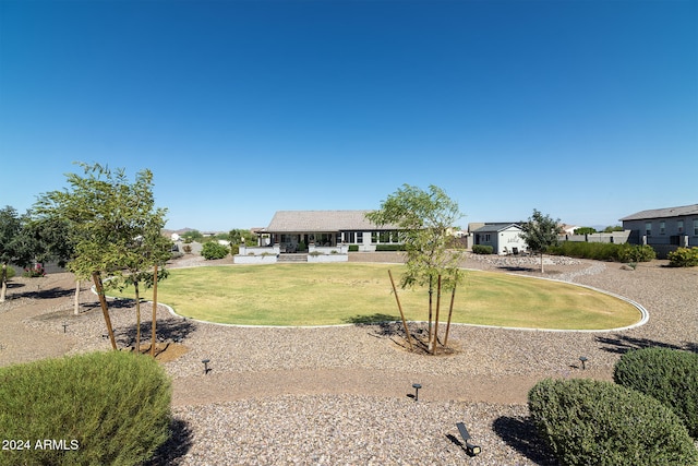 ranch-style house featuring a front lawn