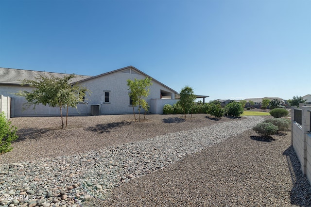 view of side of property with central AC