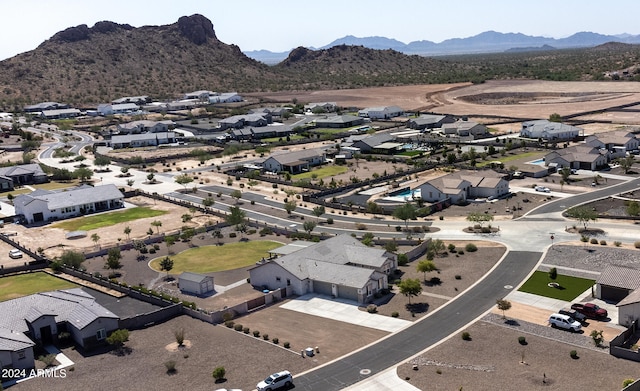 birds eye view of property featuring a mountain view