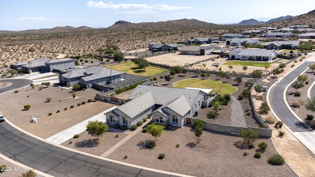 birds eye view of property with a mountain view