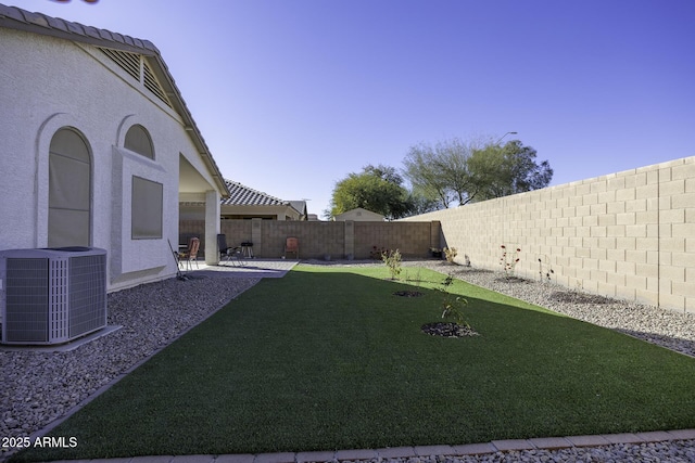 view of yard featuring a patio area and cooling unit