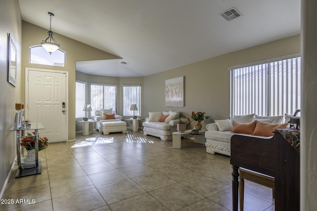 tiled living room with lofted ceiling