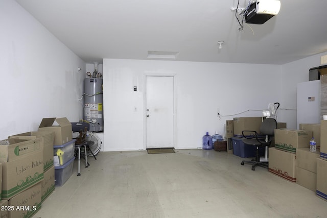 garage with a garage door opener and water heater