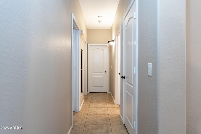 corridor with light tile patterned floors