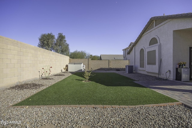 view of yard featuring central air condition unit