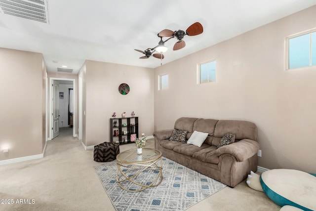 living room featuring light colored carpet and ceiling fan