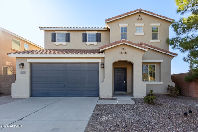 mediterranean / spanish-style house featuring a garage