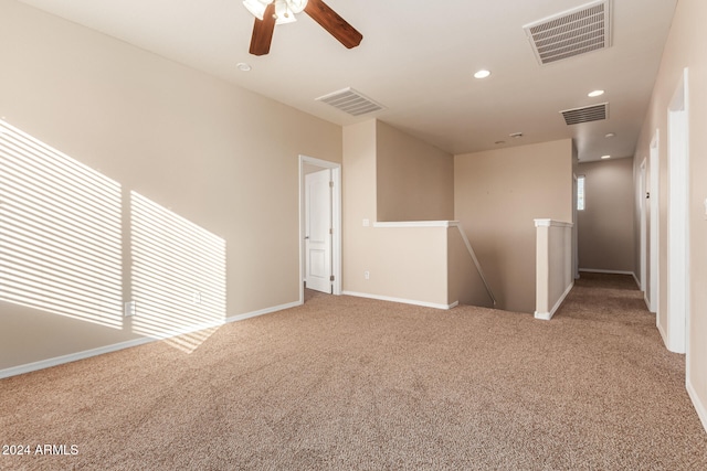 carpeted empty room with ceiling fan