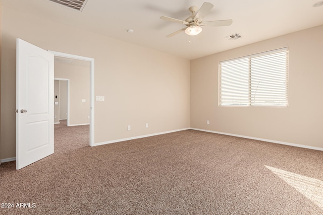 empty room with carpet flooring and ceiling fan