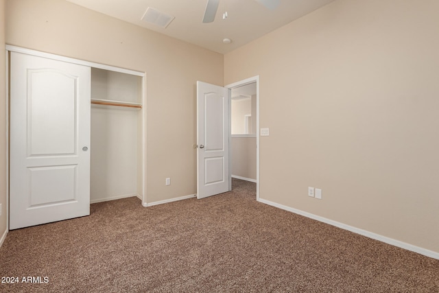 unfurnished bedroom featuring carpet flooring, a closet, and ceiling fan