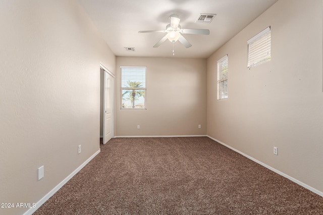 unfurnished room featuring carpet floors, ceiling fan, and a healthy amount of sunlight