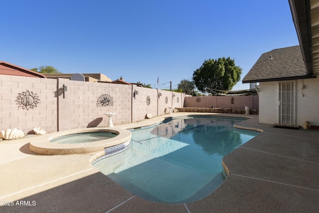 view of swimming pool featuring a patio area, a fenced backyard, and a pool with connected hot tub