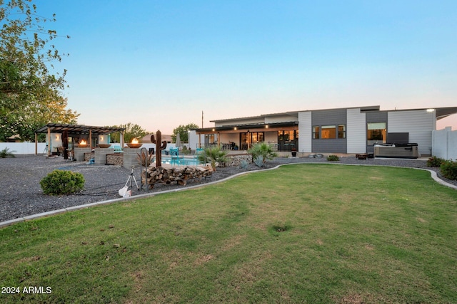 rear view of property featuring a lawn, an outdoor pool, a pergola, a patio area, and a hot tub