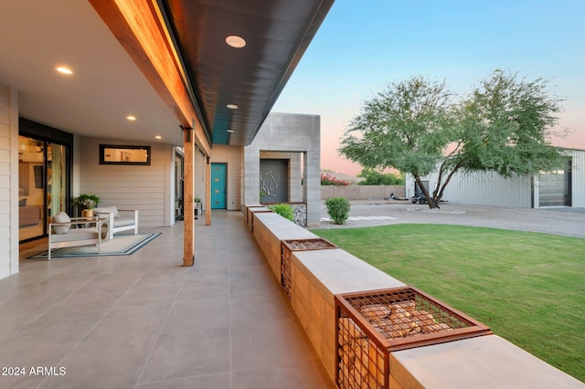 patio terrace at dusk with a lawn