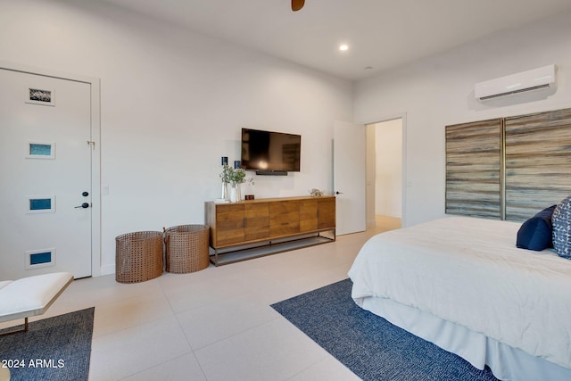 bedroom featuring a wall unit AC and recessed lighting