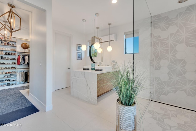 full bath with a spacious closet, a wall unit AC, a tile shower, and vanity