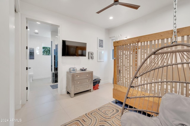 bedroom with tile patterned floors, ensuite bath, baseboards, and recessed lighting