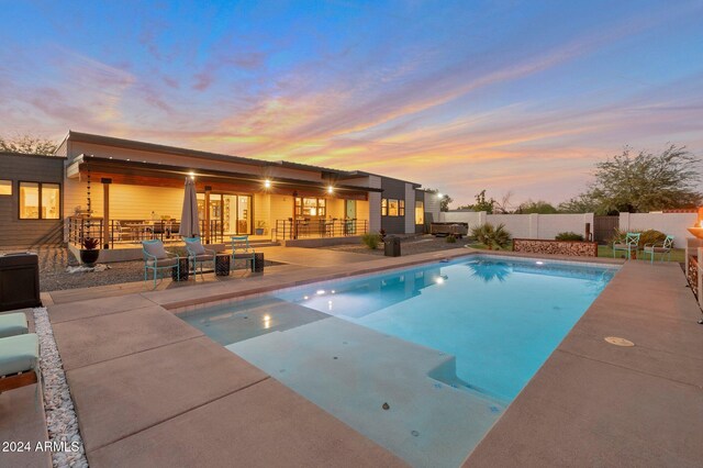 view of pool with a fenced in pool, a patio area, fence, and an outdoor living space