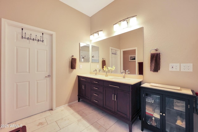 bathroom with vanity and tile patterned flooring