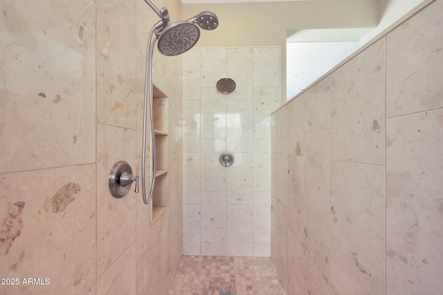 bathroom featuring tiled shower