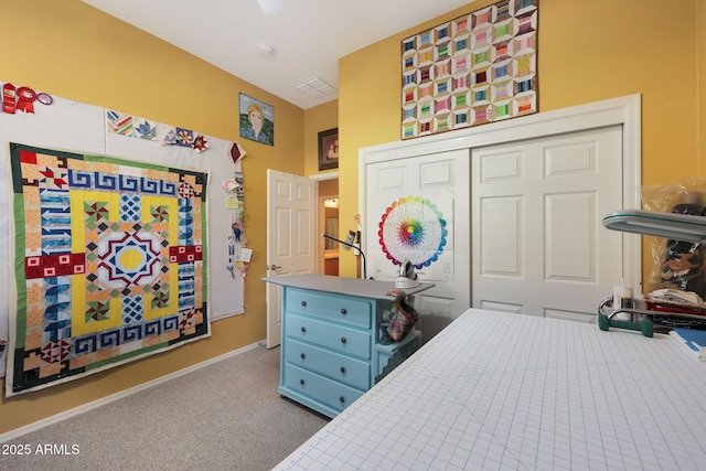 carpeted bedroom with a closet