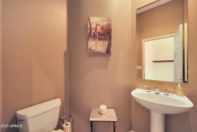 bathroom with sink and toilet