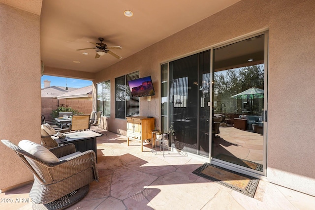 view of patio featuring ceiling fan