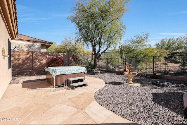 view of patio / terrace featuring a hot tub