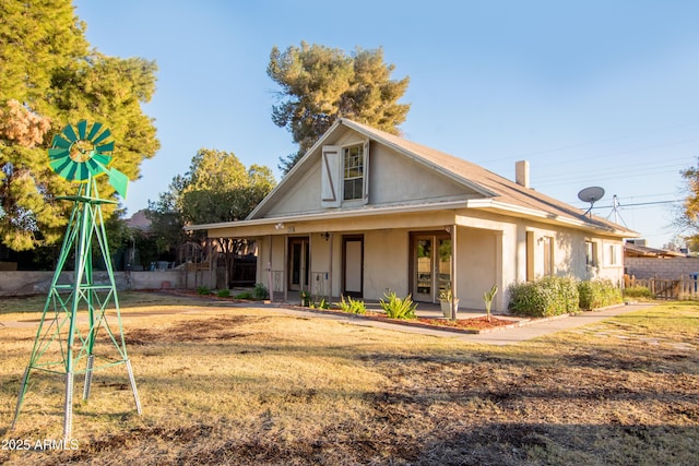937 E 6th Ave, Mesa, AZ 85204 - view of front of house featuring stucco siding, french doors, and covered porch
